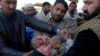 A health worker gives a polio vaccine to an Afghan refugee child in Peshawar (file photo).
