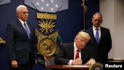 U.S. President Donald Trump signs an executive order for a U.S. travel ban at the Pentagon in Washington on January 27.