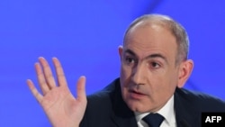 Armenia's Prime Minister Nikol Pashinyan gestures as he holds his annual press conference in Yerevan on January 31, 2025. (Photo by KAREN MINASYAN / AFP)