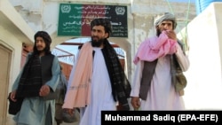 Taliban members leave prison after they were released in Kandahar on June 1 as part of ongoing negotiations with the Afghan government. 