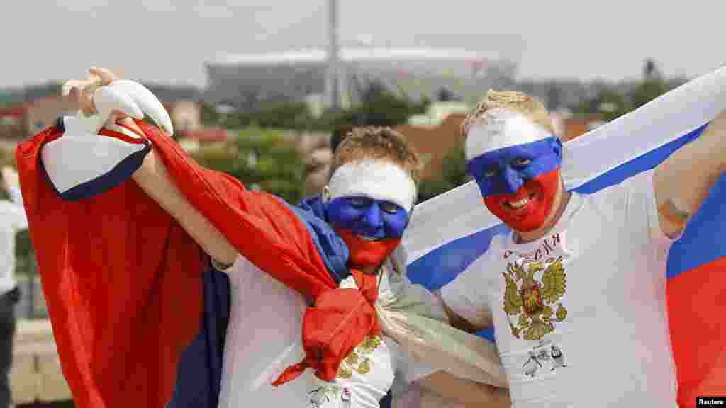 Russian soccer fans cheer outside the National Stadium in Warsaw.
